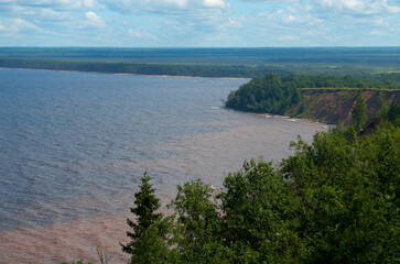 River landscape with islands and cloudy sky in the background