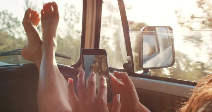 Woman with smartphone, road trip and travel in car, adventure in Italy and picture edit on mobile app for social media content. Summer vacation, drive at sunset with phone and freedom on holiday.