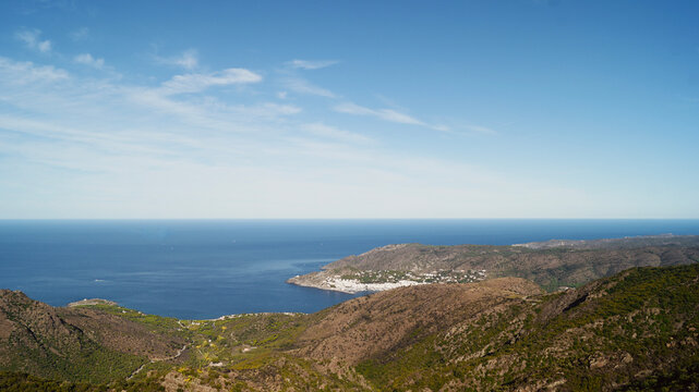 Coastal view over El Port de la Selva Mediterranean village on the Costa Brava, Catalonia, Spain. Famous tourist destination of the Costa Brava. View from village of Santa Creu de Rodes. 
