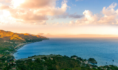 travel landscape scenic picture of beautiful highland mountain town in sunrise or sunset with sea shore on background