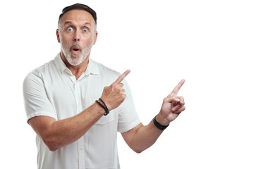 PNG studio portrait of a mature man pointing to copyspace against a grey background