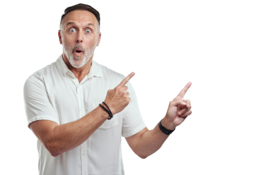 PNG studio portrait of a mature man pointing to copyspace against a grey background