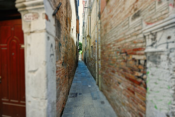 Narrow brick streets in Venice, Italy.