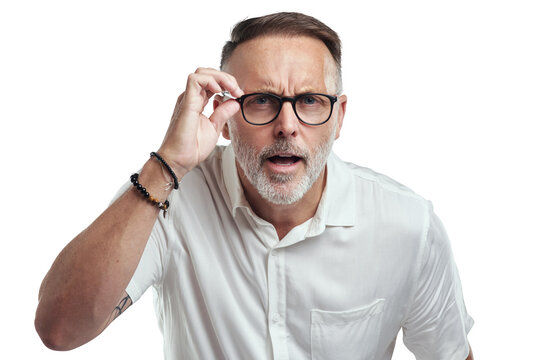 PNG Studio Portrait Of A Mature Man Wearing Spectacles And Looking Confused Against A Grey Background