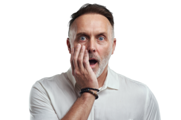 PNG studio portrait of a mature man looking surprised against a grey background