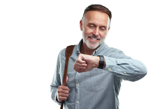 PNG studio shot of a mature man carrying a bag and checking the time on his wristwatch against a grey background