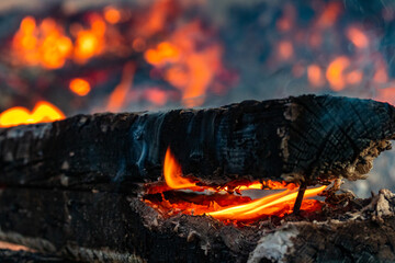 A piece of wood is burning from the inside