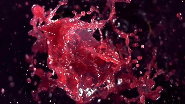Black Grape Juice Splashing. Slow motion.