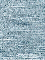 Pastel blue rough mortar cement stripe wall texture. Grunge striped pattern plasterer concrete wall background.
