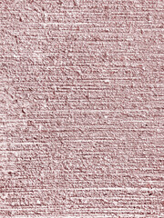 Pastel pink rough mortar cement stripe wall texture. Grunge striped pattern plasterer concrete wall background.