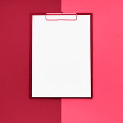 Blank clipboard mockup on red viva magenta color background. Top view, copy space.