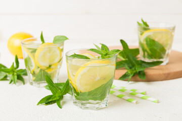 Mojito cocktail. Refreshing mojito cocktail with lime, lemon and mint in a tall glass with a stick