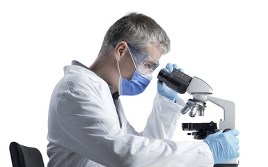 Scientist analyzing samples under the microscope