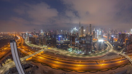 Fototapeta na wymiar Panoramic skyline of Dubai with business bay and downtown district night to day timelapse.