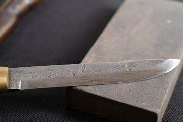 Background with a pattern of Damascus steel. Macro shot of damascus knife texture. Damascus steel...