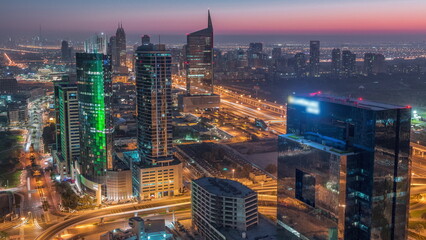 Aerial view of media city and al barsha heights district area night to day timelapse from Dubai marina.