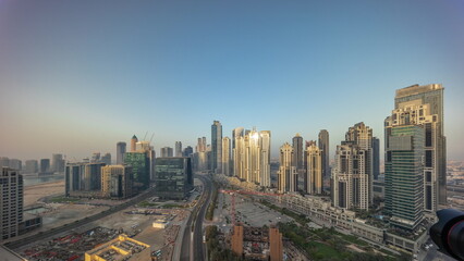 Obraz premium Panorama of Bay Avenue with modern towers residential development in Business Bay aerial all day timelapse