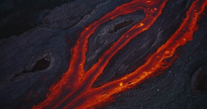 Aerial view of river of red hot molten lava flowing from the Hawaii Mauna Loa volcano eruption of 2022, Shot on RED