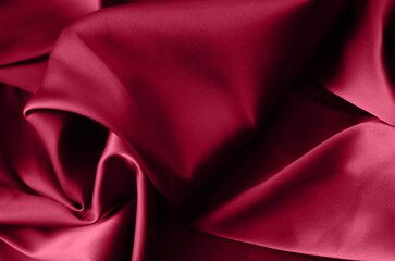 Fabric background in burgundy color.