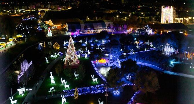Aerial view of the Christmas decoration. City decorated with Christmas lights. Giant Christmas tree.