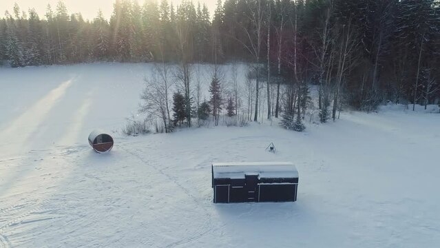 Isolated lonely tiny wooden cabin homes at Nuuksion Taika Vihti Finland aerial
