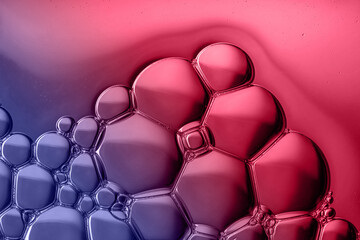 Magenta and purple liquid background with bubbles. Top view. Change color of the year theme. 