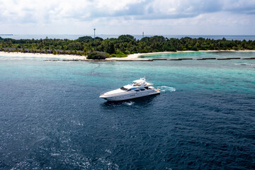 Fototapeta na wymiar Aerial View, Asia, Indian Ocean, Maldives, Lhaviyani Atoll, Kuredu, Luxury Motor Yacht offshore