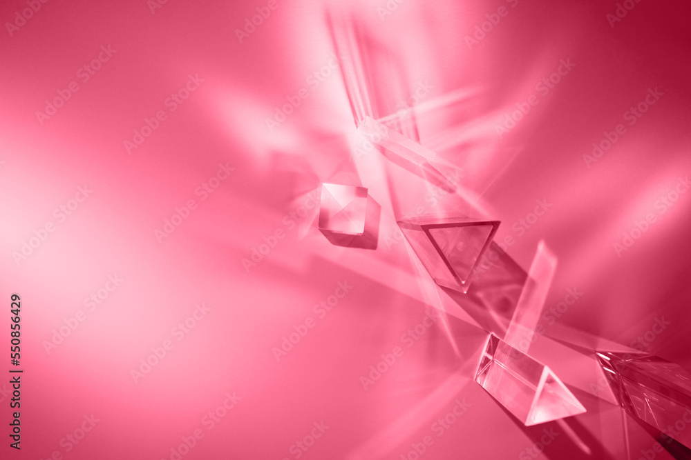 Wall mural glass prisms and cubes with spectrum rays on magenta backdrop. abstract background with reflection a