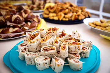 a buffet with pancake slices, filled with vegetables