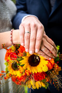 a bride and groom holding a bouquet