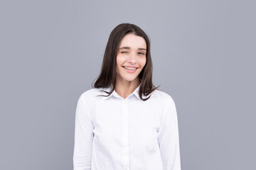 Happy smiling woman portrait. Attractive young pretty cheerful girl in casual clothing feeling happy and carefree, isolated background.