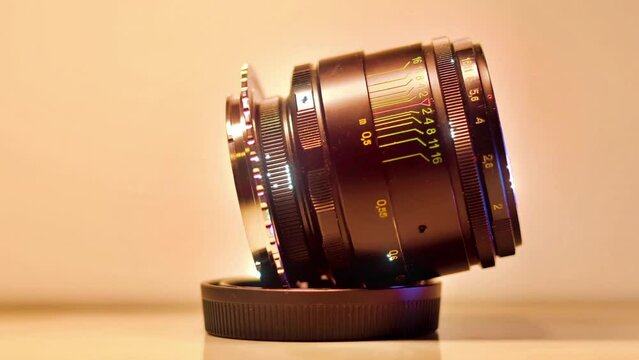Vintage camera lens in close-up and sparkling pan and zoom video