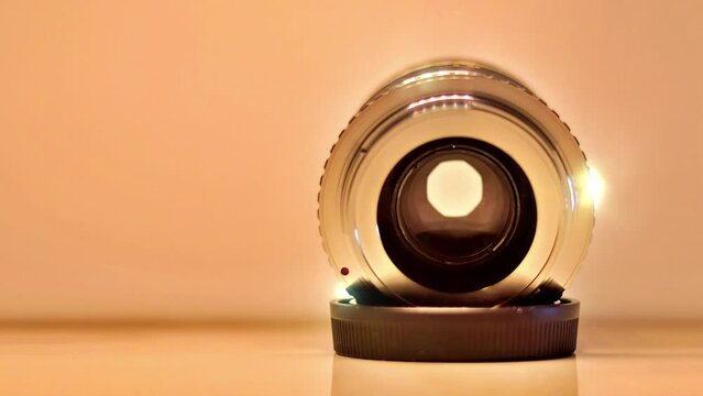 Vintage silver lens and gold backdrop in close-up panning video