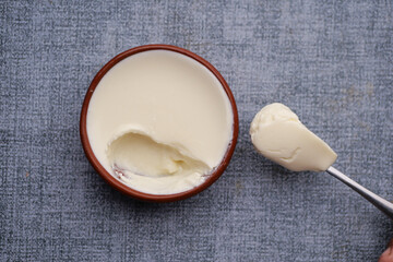 fresh yogurt in a bowl on table 