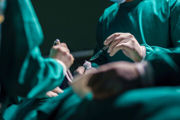 A team of professional doctors perform surgery in a hospital, a group of surgeons working in the operating theater.