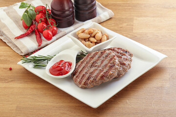 Grilled beef burger cutlet with sauce