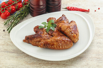 Roasted chicken wings with spicy sauce