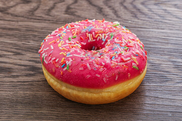 Sweet glazed struwberry donut with icing