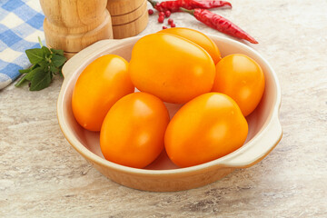Sweet ripe yellow tomato in the bowl