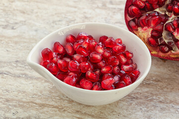 Ripe red Pomegranate seeds in the bowl