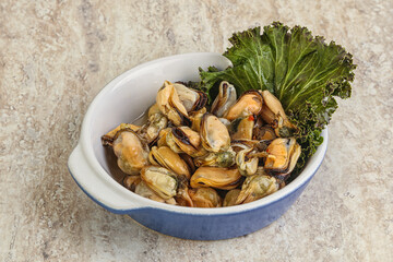 Tasty marinated mussels in the bowl
