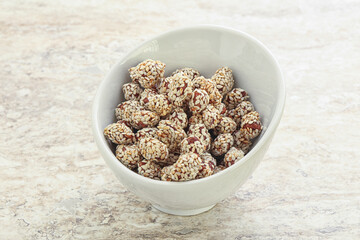 Sweet peanut in sesame seeds