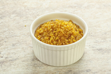 Raw bulgur in the bowl