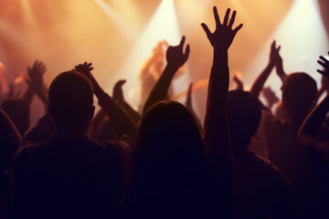 Music, lights and hands of crowd at concert for party, disco and live band performance. Dance, nightclub and silhouette of audience listening to artist on stage at festival for energy, rave and event