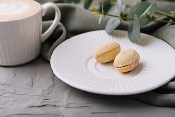 Cup of coffee and cookies in the shape of walnuts