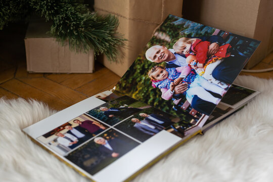family photo book near the Christmas tree