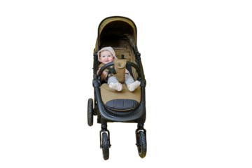 A happy child is sitting in a baby carriage on a studio, isolated on a white background. Smiling toddler baby boy in a transformer stroller for transporting children, age eight months