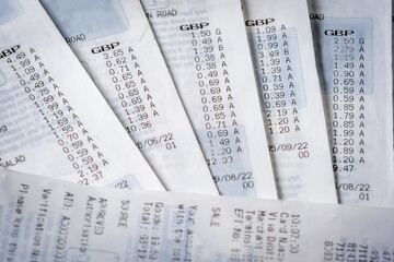 Obraz premium British shopping receipt stacks background in england uk