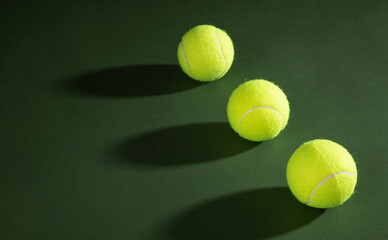 Tennis balls on the green background.