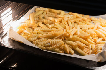 French fries are cooking in the oven